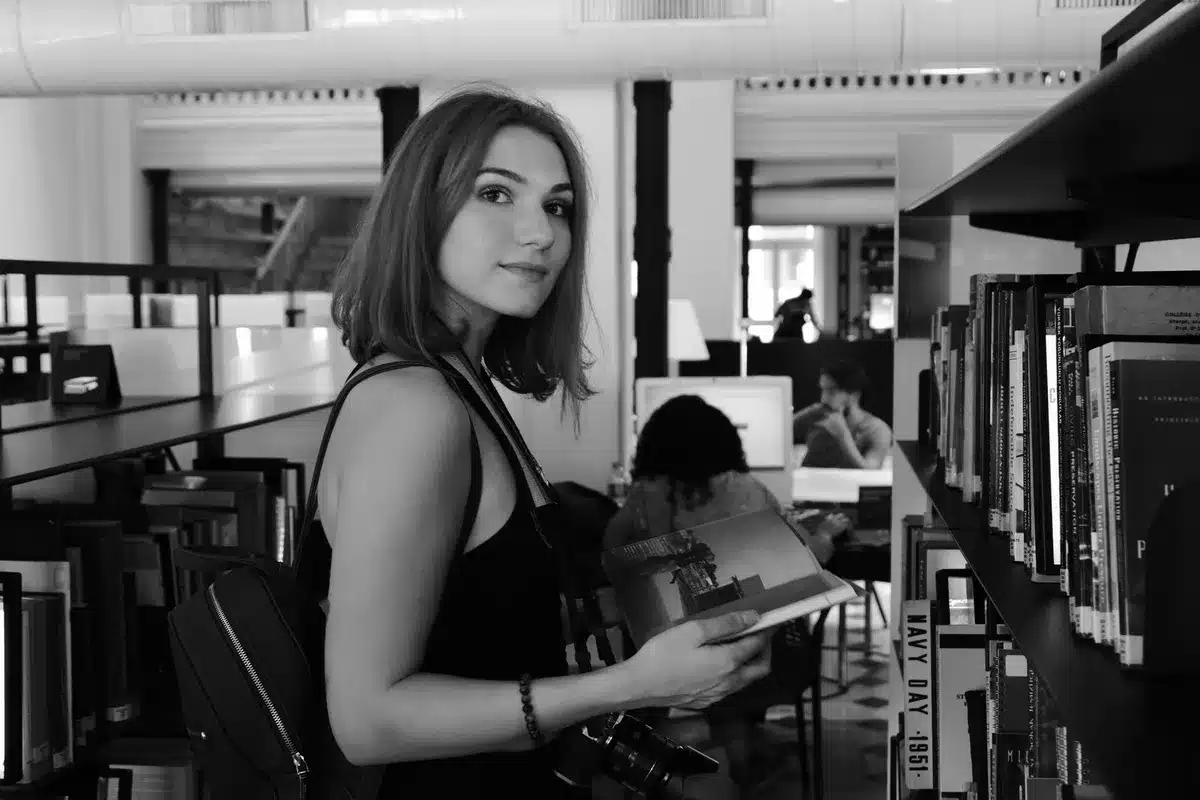 Person reading a memoir or autobiography book