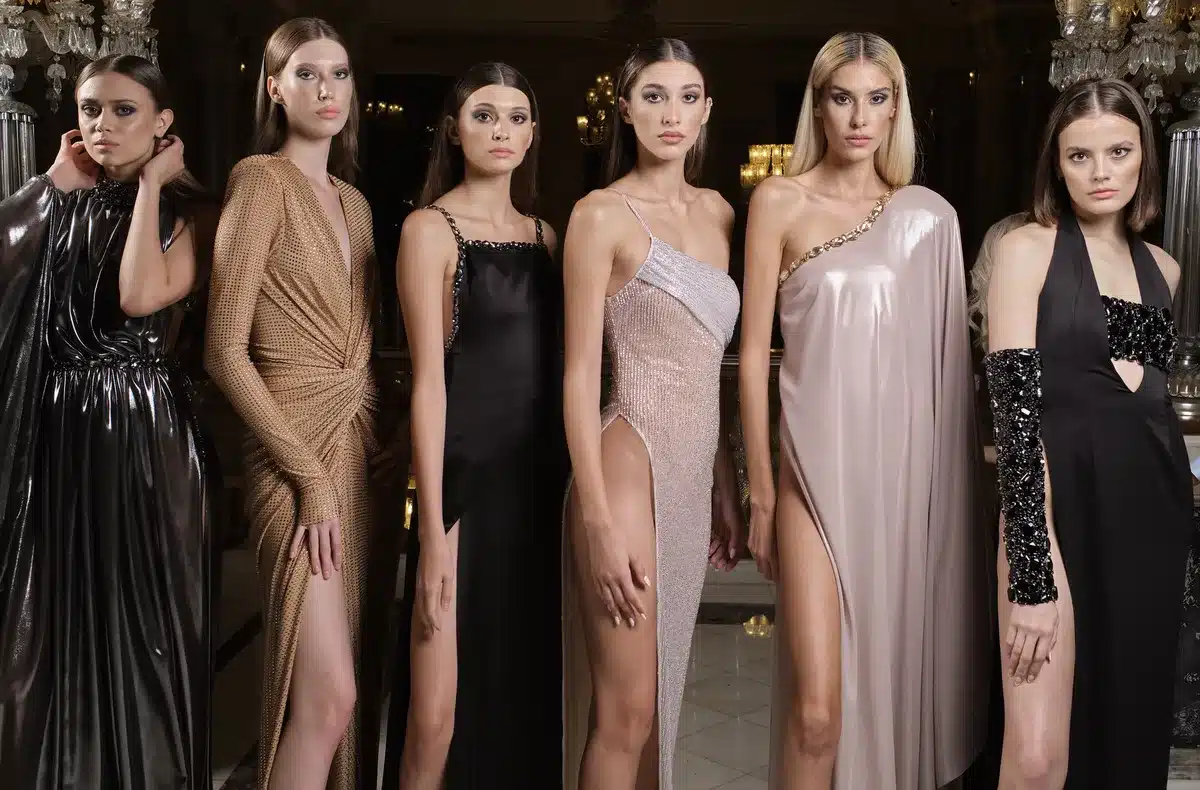 Elegant haute couture outfit on runway with tailored silhouettes and classic accessories