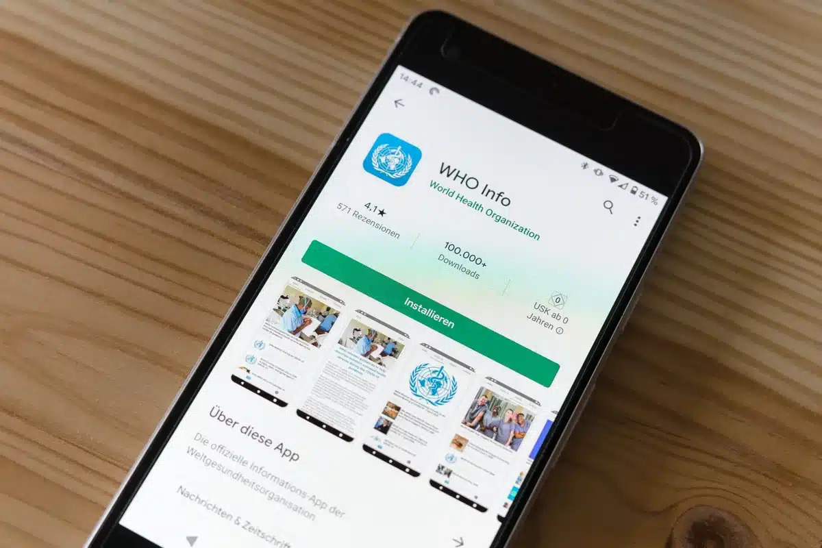 Smartphone showing Google News app with publisher menu and follow options on mobile interface