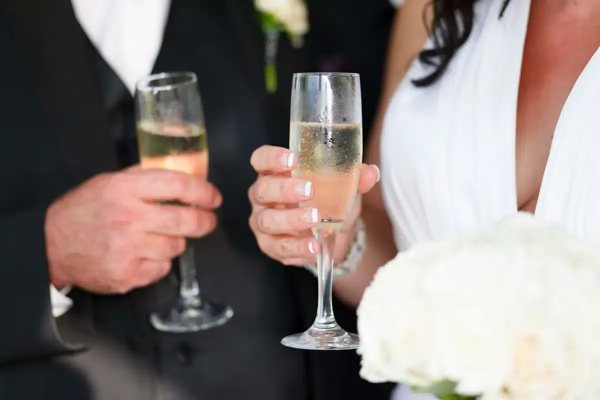 An elegant summer wedding ceremony with guests celebrating the newlyweds