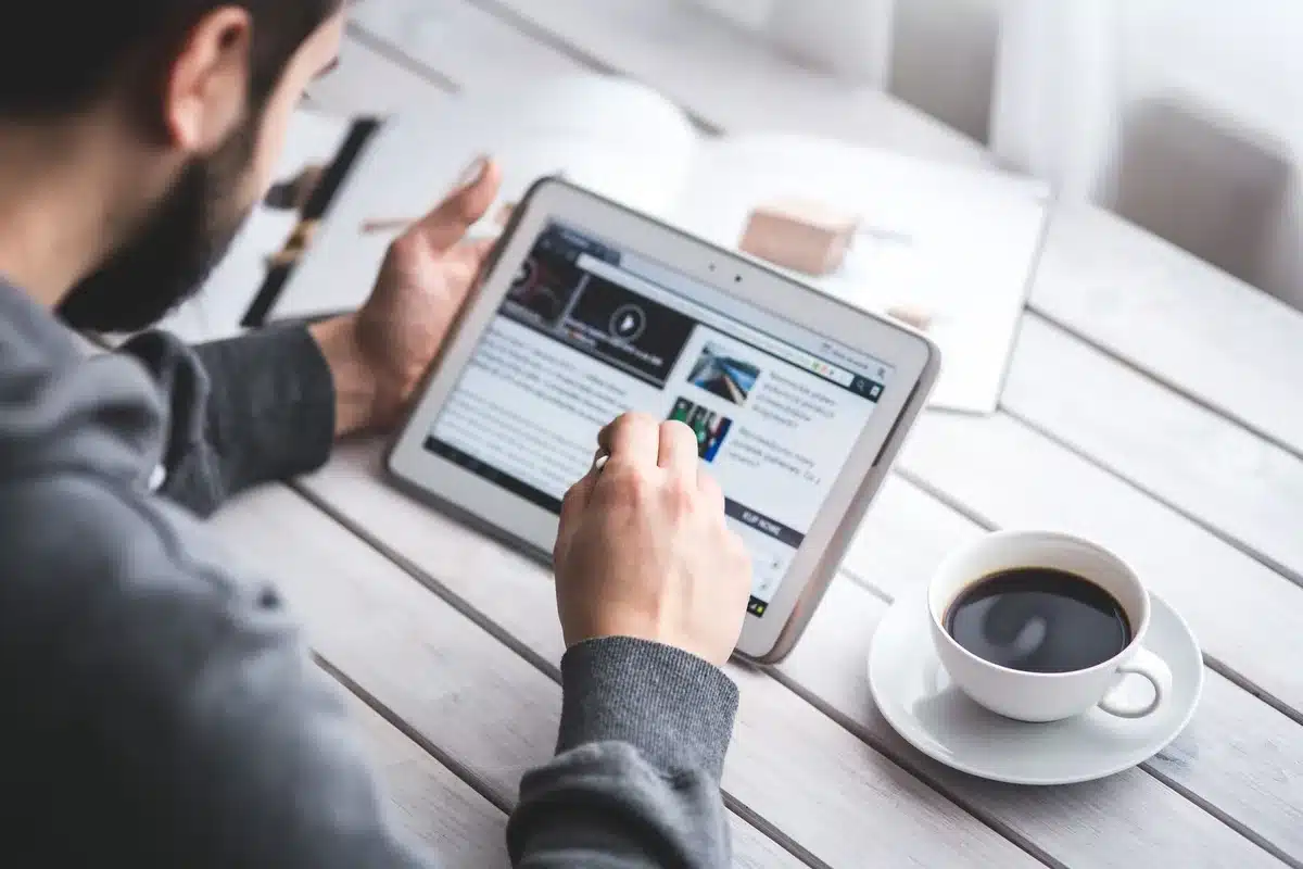 Person reading trusted news sources on tablet device