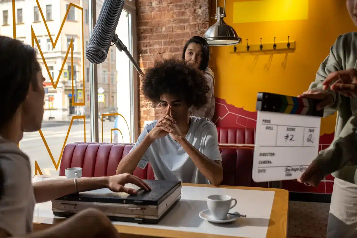 Actors on a busy film set during rehearsal and production