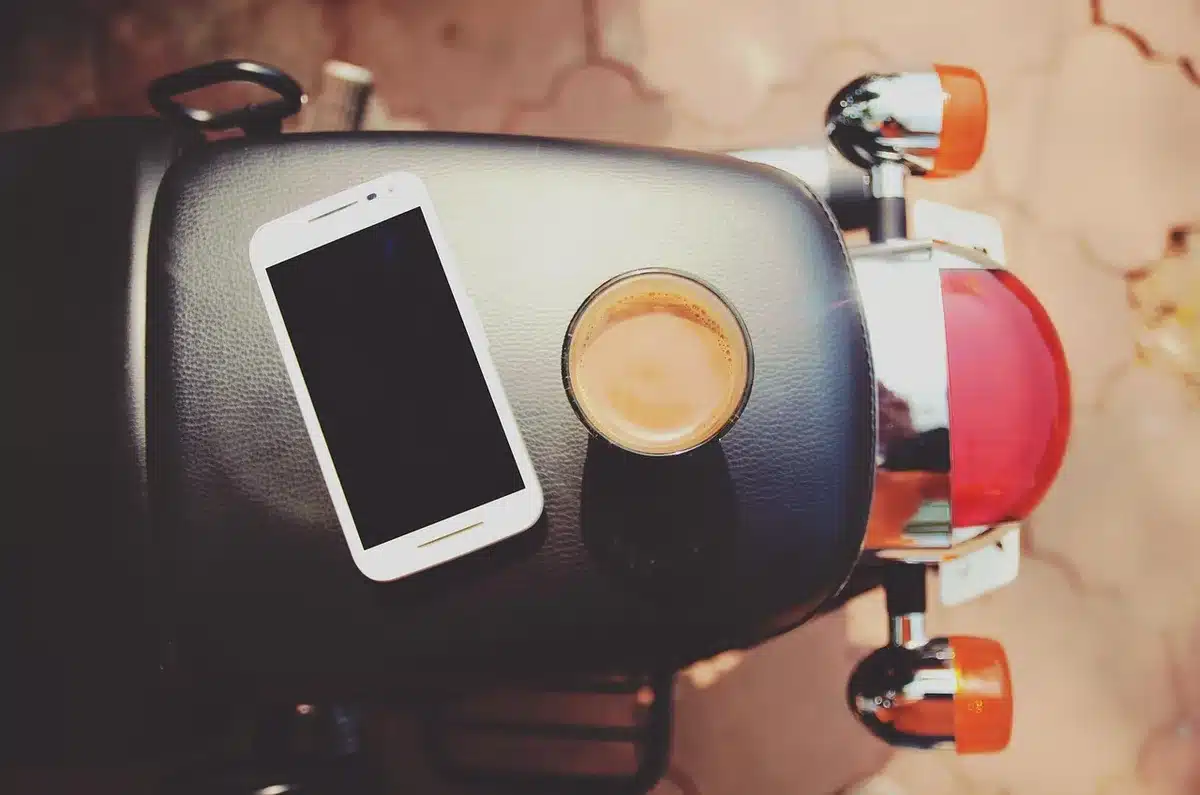 Close-up of hands scrolling newsfeed on a smartphone