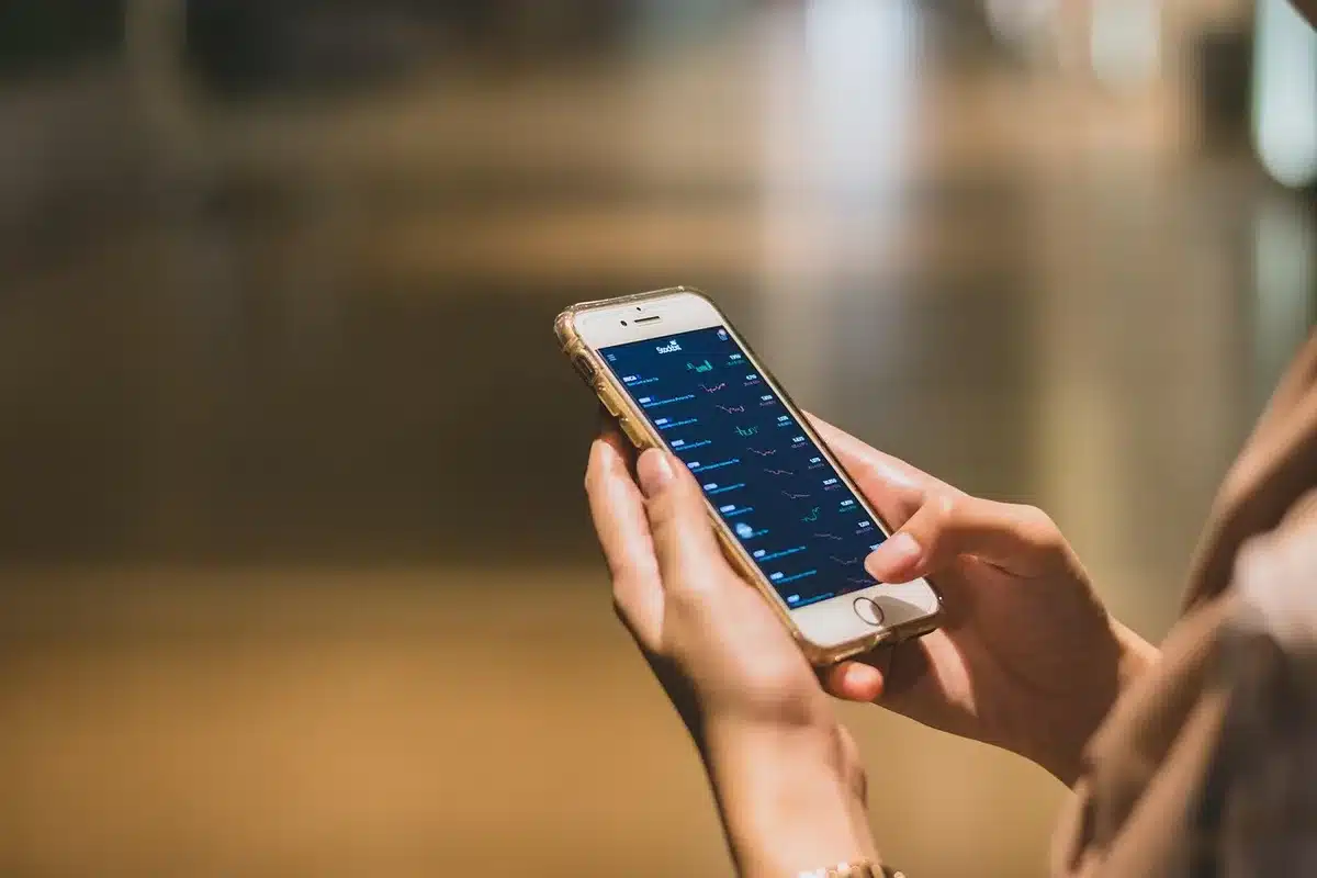 Smartphone showing Google News interface with multiple article sources and publisher options