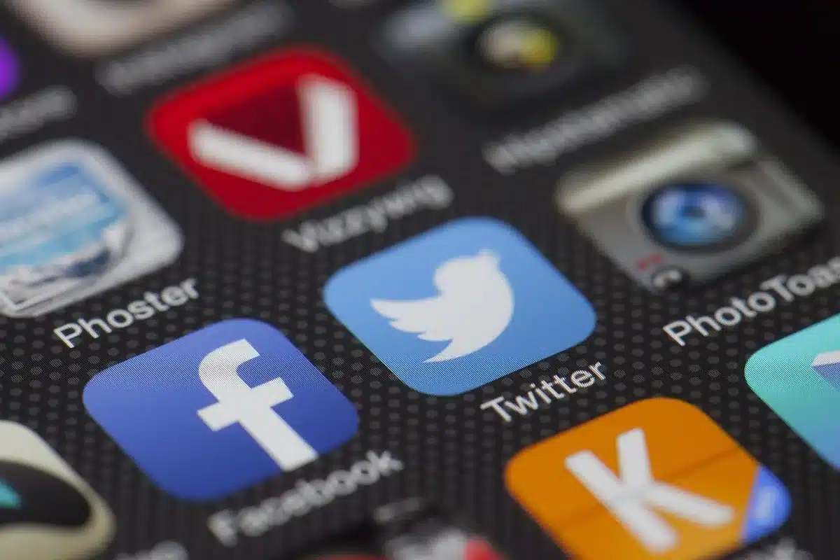 Smartphone screen showing social media feed with trending viral content and notifications