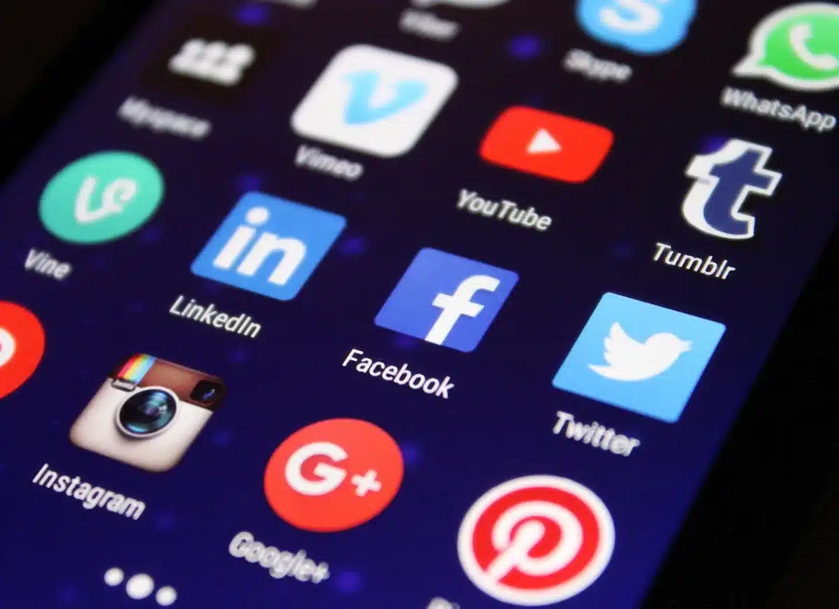 Hands interacting with a news app on a smartphone, selecting sources