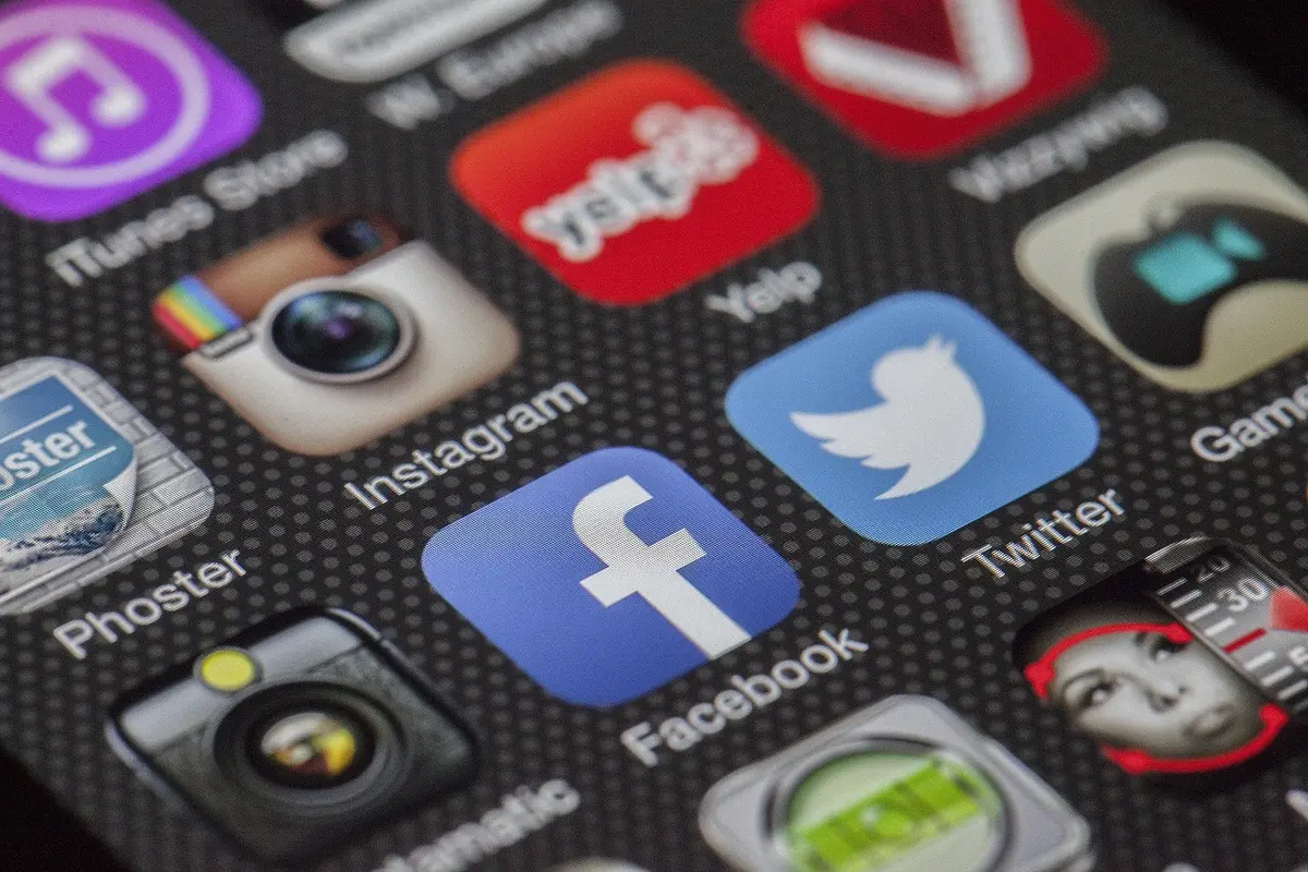 Smartphone showing a blurred family photo on social media feed
