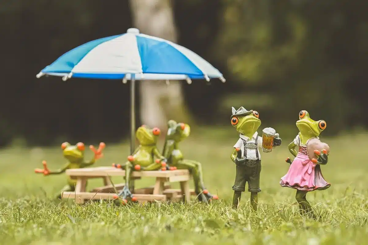 Sunlit backyard scene with children's shoes and cardigan on a bench