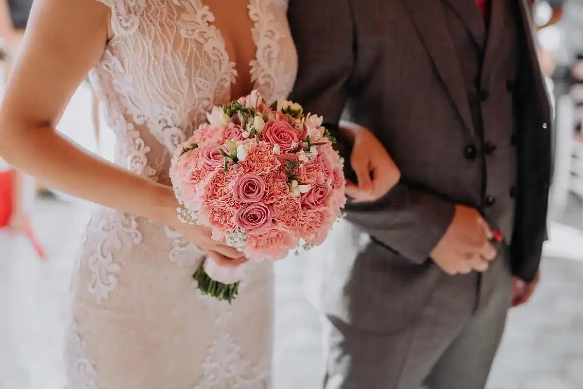 Intimate wedding setup with chairs and a small table in daylight
