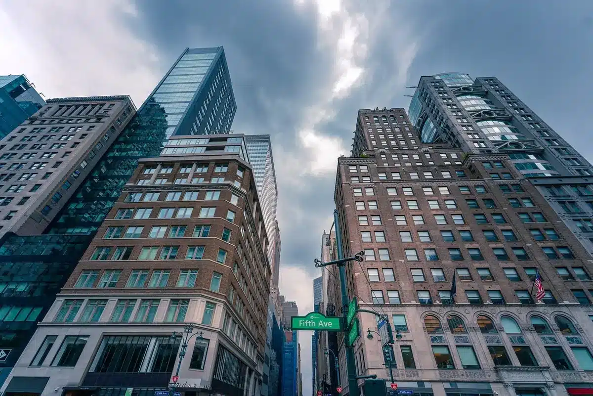 Daytime New York street with stylish pedestrians and storefronts