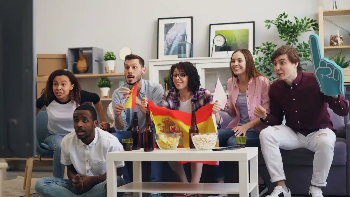 TV show colleagues in a bright studio speaking together