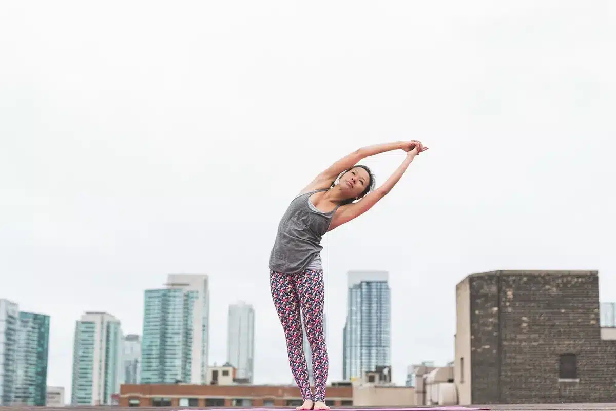 Player doing morning stretching outdoors in daylight